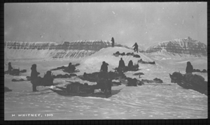 Image of Camp site, 7 teams resting, men on snow mound
